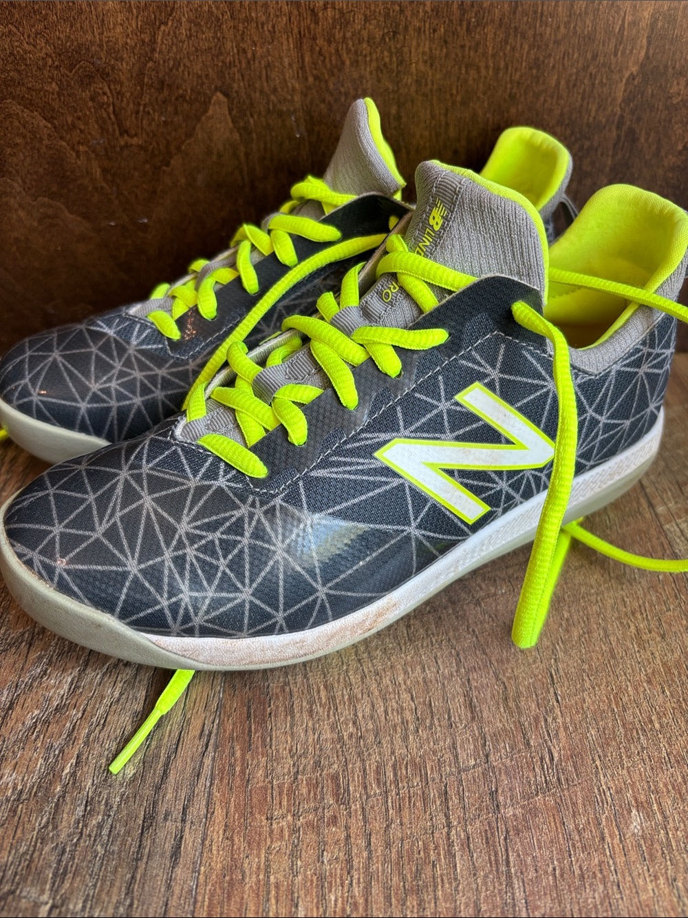 New Balance Kids Gray Geometric Cleats with Neon Yellow Accents